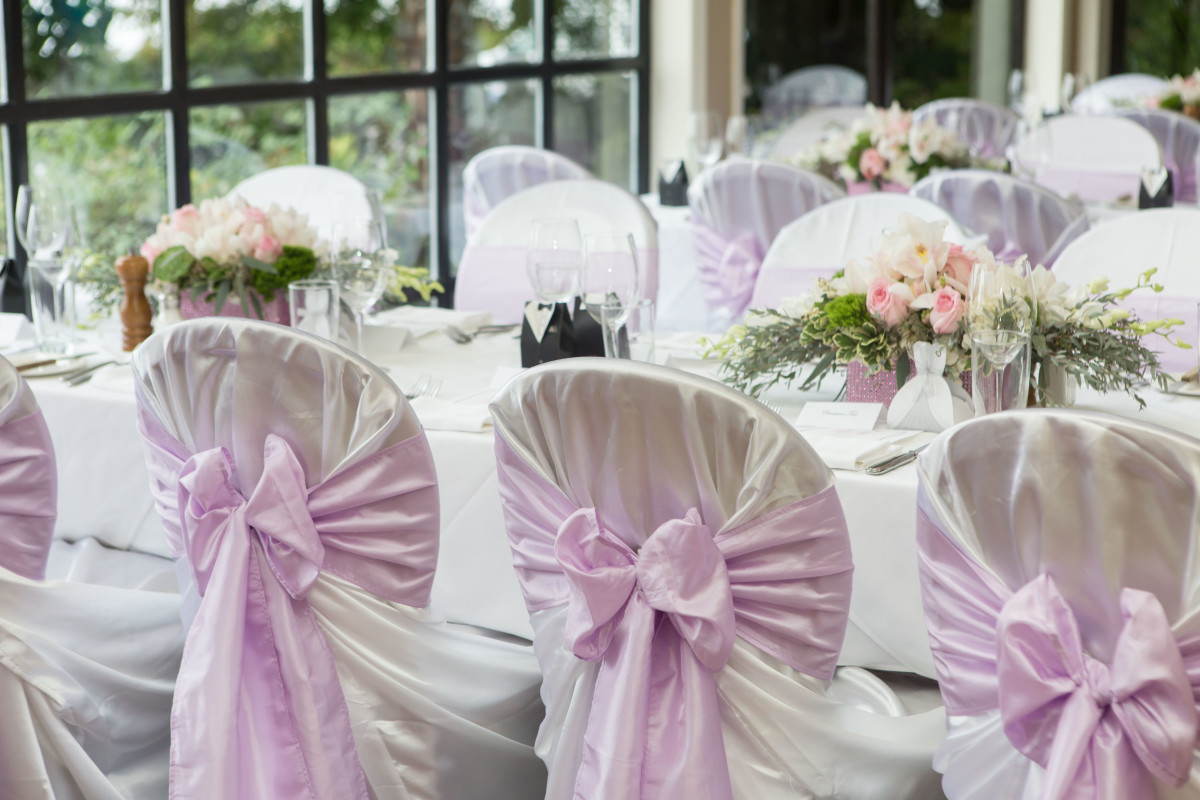 White wraps with lilac taffeta sashes