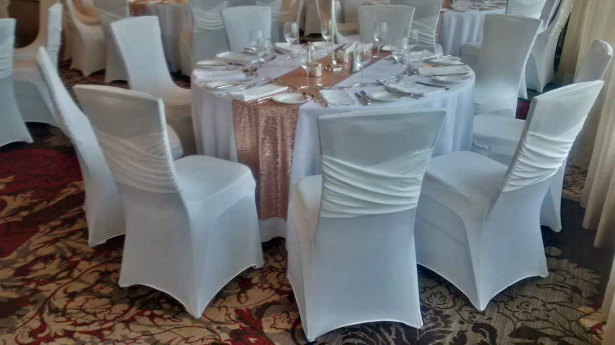 Ivory spandex covers with built in sash